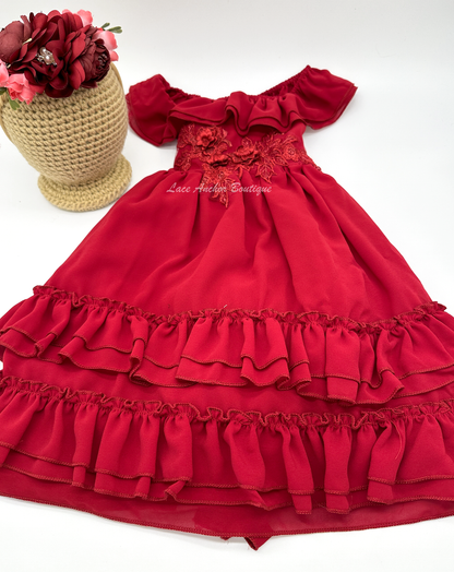 solid deep red ruffled layer dress with floral embroidered applique. Holiday sleeveless maxi dress.