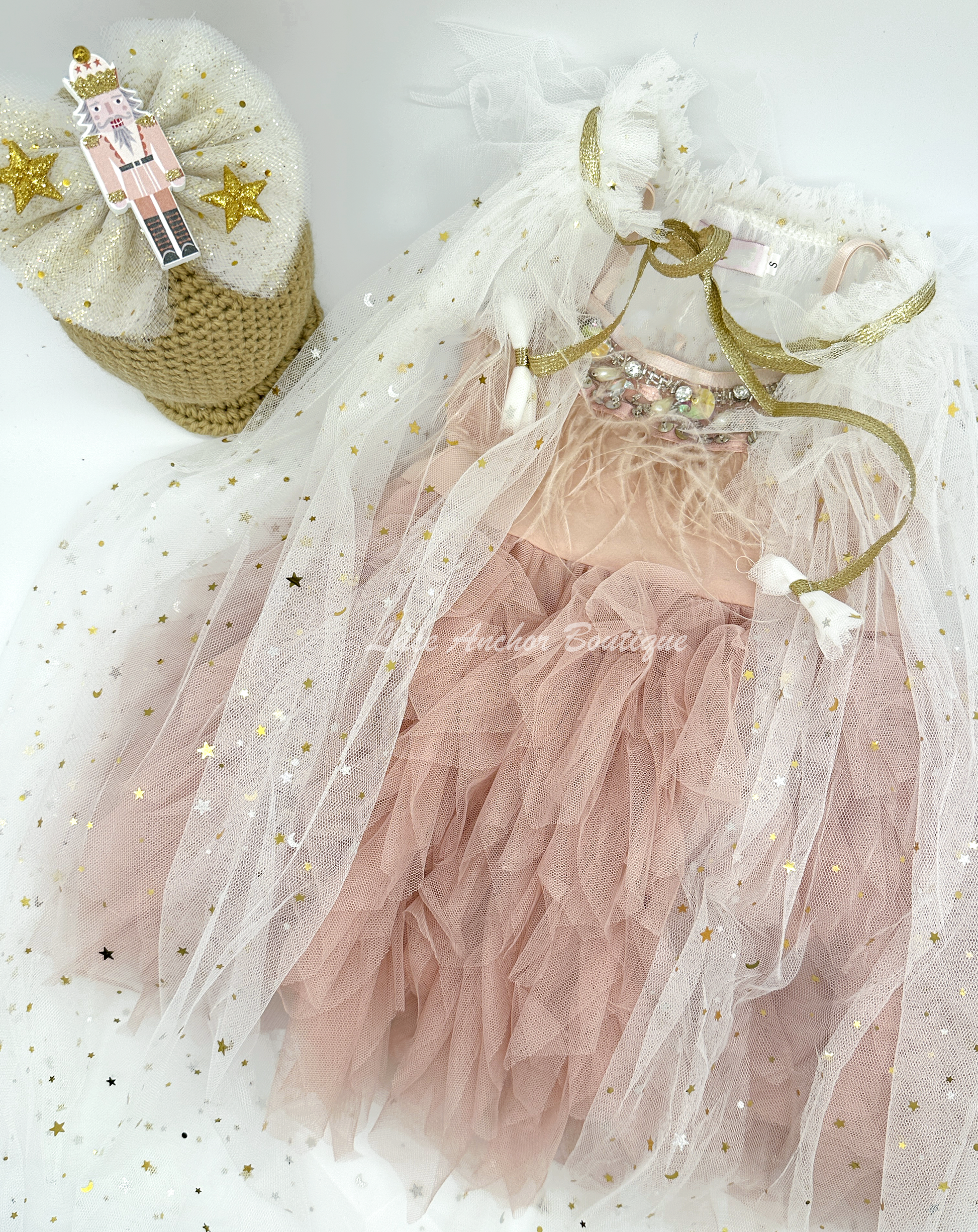 white tulle girls cape with gold ties and gold metallic stars all over