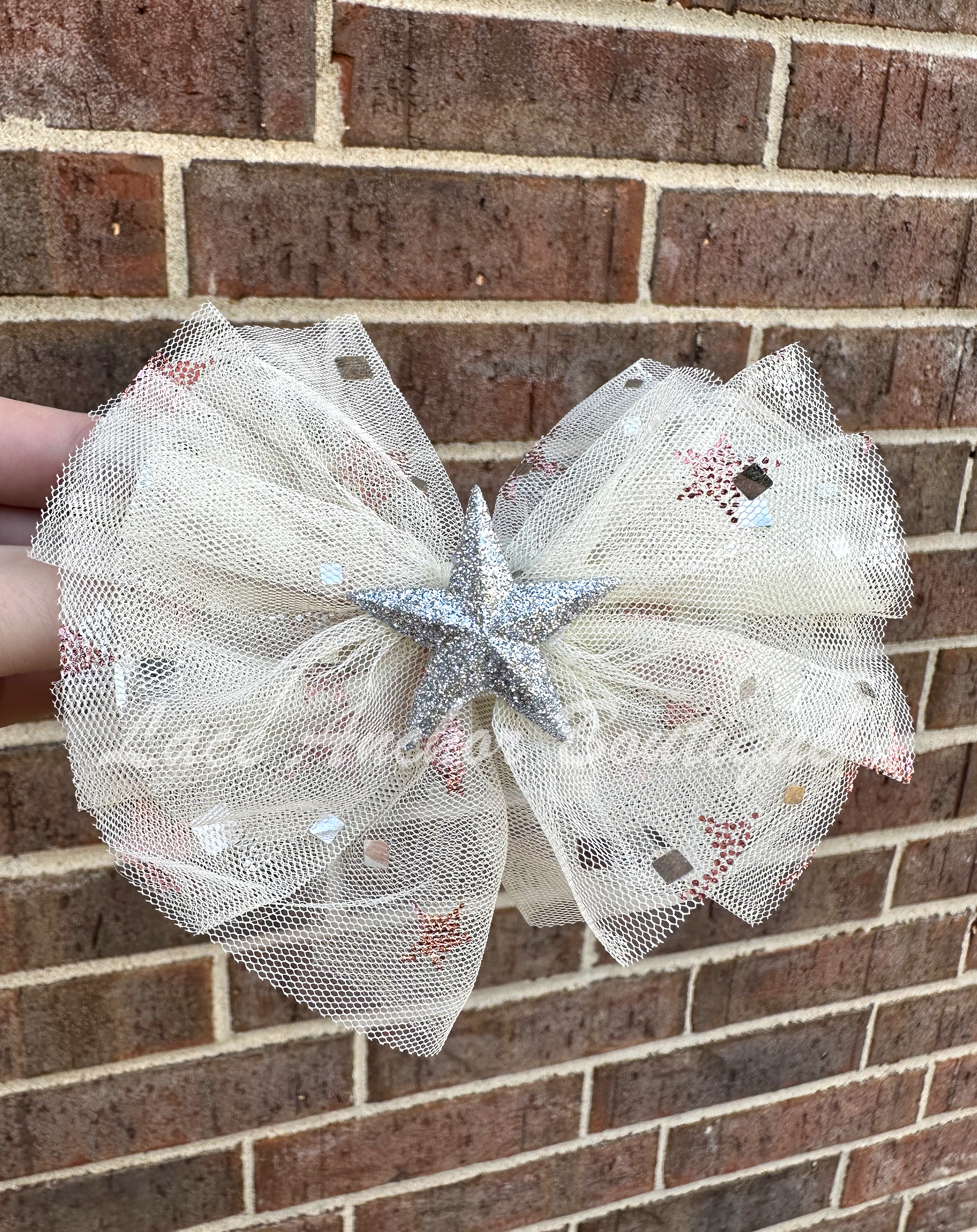 ivory sparkle sequin tulle girls hair bow with silver glitter star center