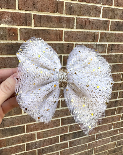 Gold spec girls hair bow with sequin glitter sparkles. White toddler girl bow.