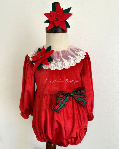 Christmas themed baby girls romper with red velvet, lace collar, 3D felt poinsettia flowers, and a vintage green and red bow.