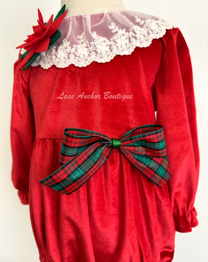 Christmas themed baby girls romper with red velvet, lace collar, 3D felt poinsettia flowers, and a vintage green and red bow.