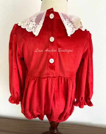 Christmas themed baby girls romper with red velvet, lace collar, 3D felt poinsettia flowers, and a vintage green and red bow.