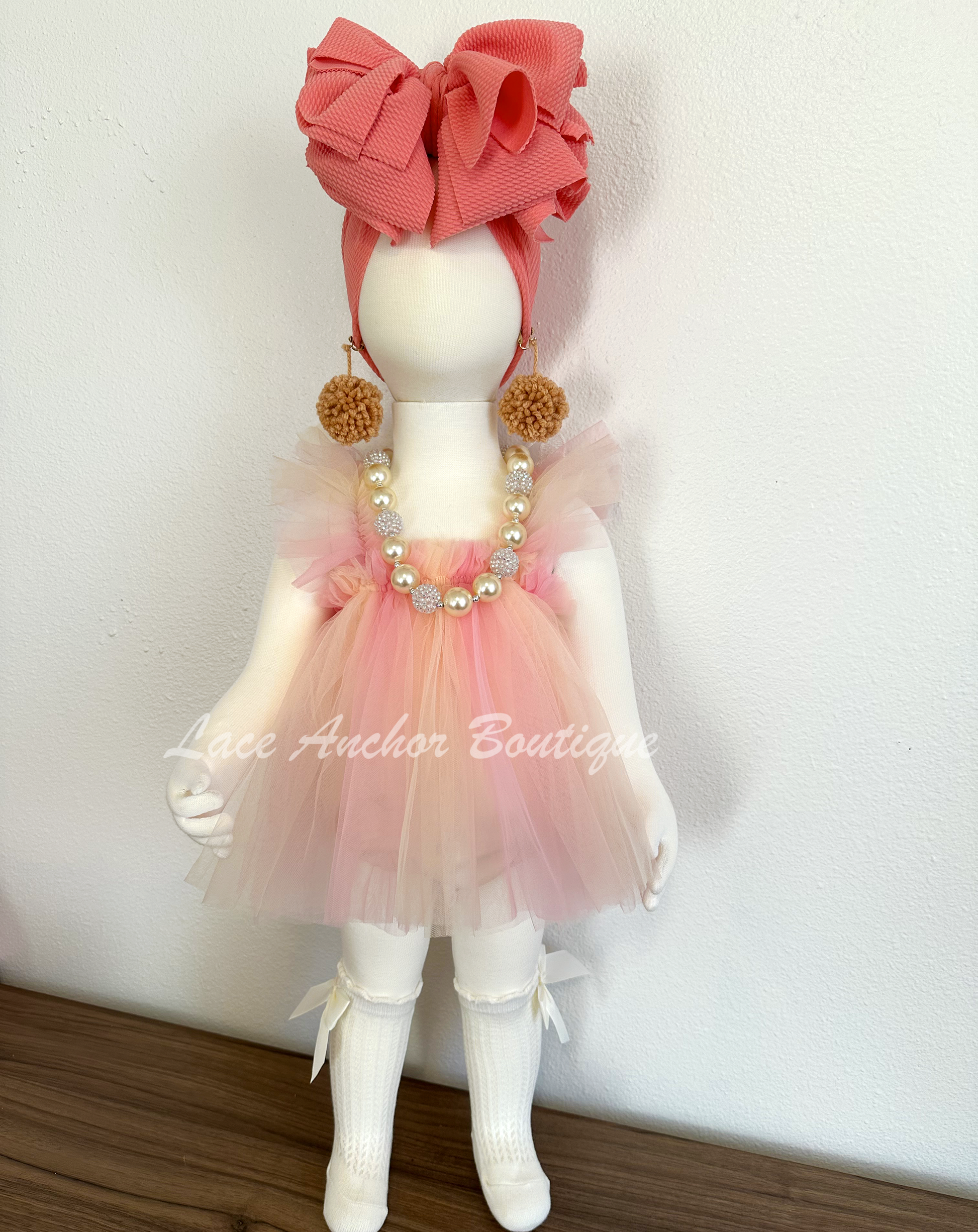 baby girls pastel peach, coral skirted romper with fairy wings. Girls dress with embroidered butterfly wings.