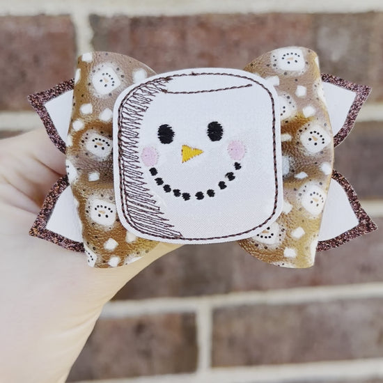 brown and white s'mores themed girls hair bow. Faux leather hot cocoa marshmallow with face glitter girl hair clip bow. Winter holiday toddler hair clip.