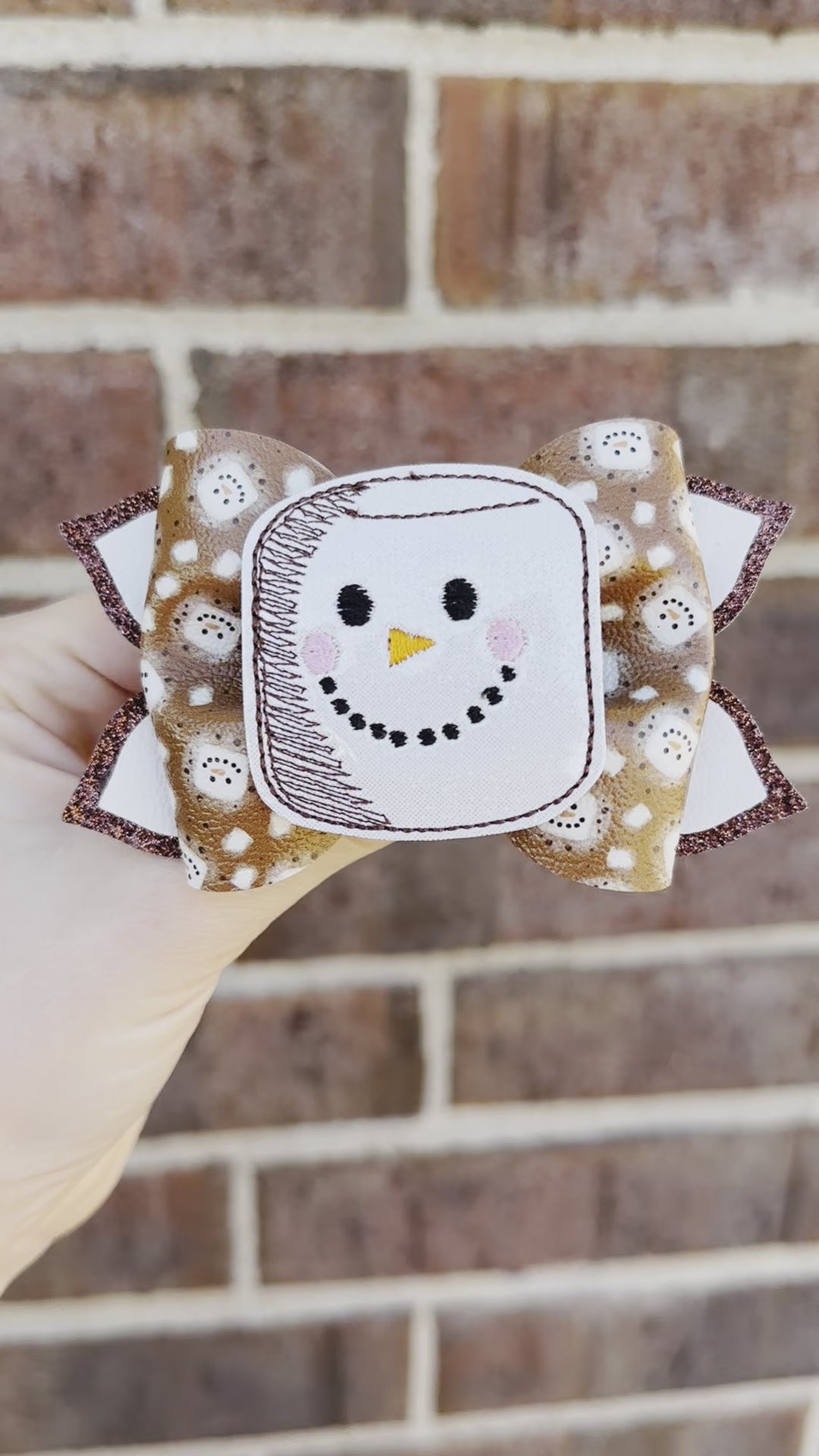 brown and white s'mores themed girls hair bow. Faux leather hot cocoa marshmallow with face glitter girl hair clip bow. Winter holiday toddler hair clip.