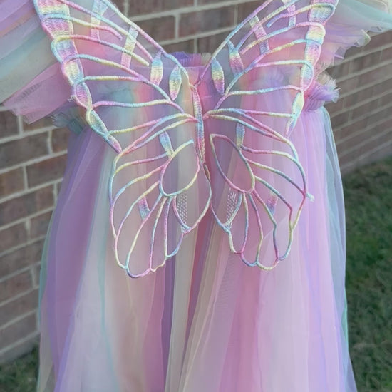 Purple rainbow fairy peach, lilac purple, light coral, pale yellow, white, teal blue knee length tulle dress with iridescent butterfly wings attached for toddlers, babies, kids.