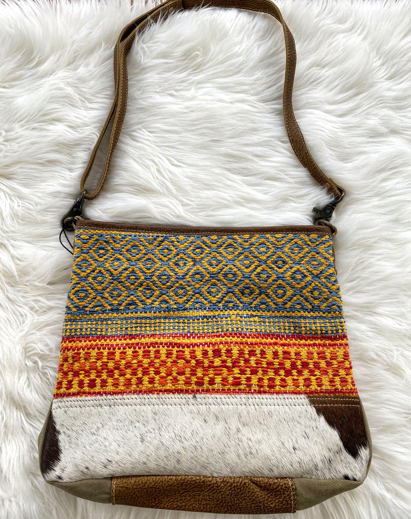 Tan Myra colorful leather and hair on cowhide shoulder bag with recycled colorful red and turquoise fabric